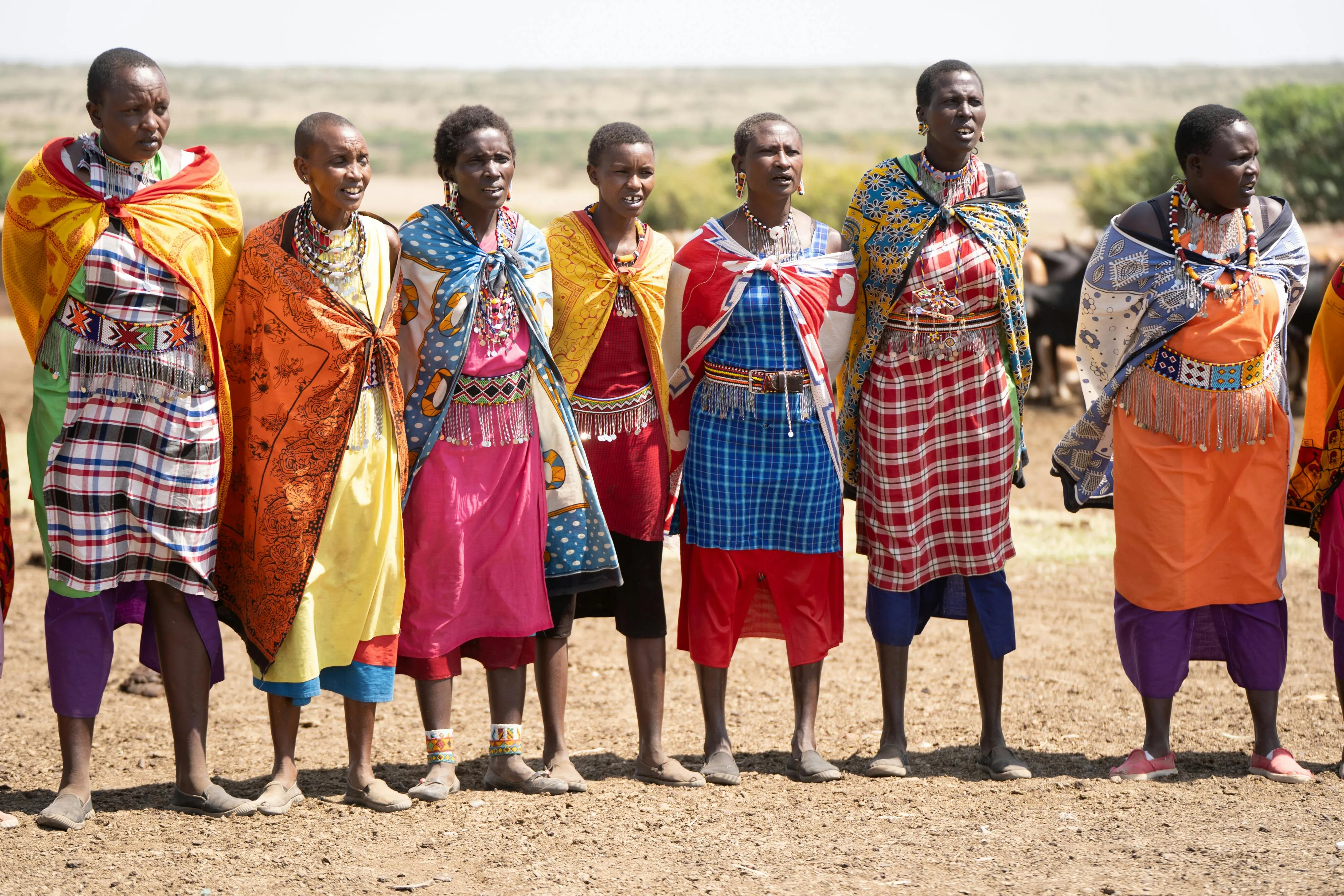 Group of Malawian women in colourful traditional chitenje fabric in a rural village