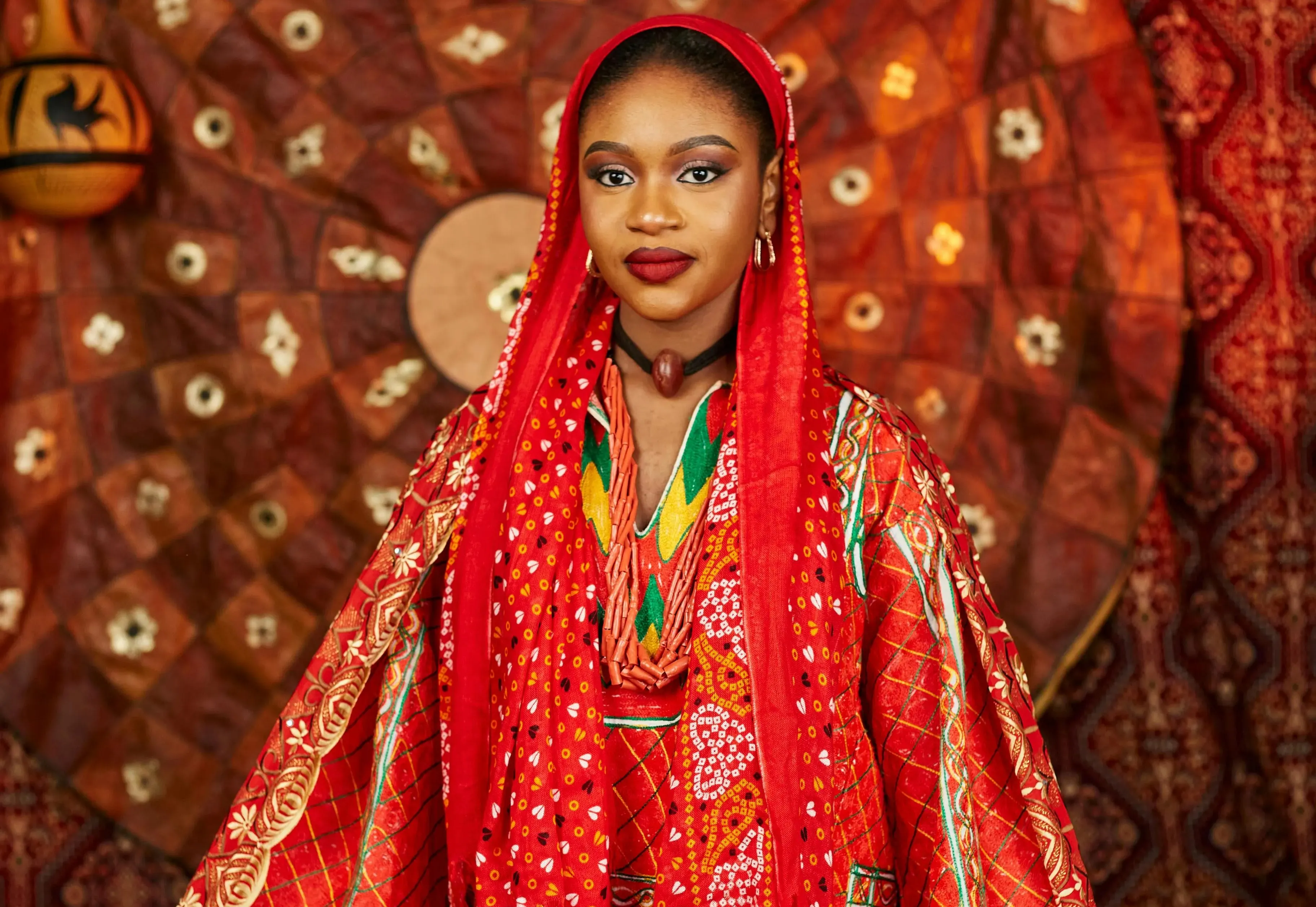 Malawian woman in stunning red traditional fabric — Cultural Etiquette in Malawi